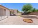 Backyard featuring a covered patio, low maintenance gravel, and artificial turf at 10617 W Ross Ave, Peoria, AZ 85382