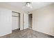 Bedroom with carpet flooring, a ceiling fan, and a closet with sliding doors at 10617 W Ross Ave, Peoria, AZ 85382