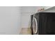Modern laundry room equipped with sleek, dark-colored washer and dryer at 10617 W Ross Ave, Peoria, AZ 85382