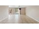 Spacious living room features tile floors, a ceiling fan, and a sliding glass door to the backyard at 10617 W Ross Ave, Peoria, AZ 85382