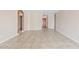 Spacious living room features tile floors, neutral paint, arched doorway, and ample natural light at 10617 W Ross Ave, Peoria, AZ 85382