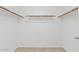 Spacious walk-in closet featuring ample shelving and clothing rods at 10617 W Ross Ave, Peoria, AZ 85382