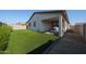 Spacious backyard featuring artificial grass and a covered patio perfect for entertaining at 10964 W Garfield St, Avondale, AZ 85323
