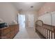 Bright Bedroom with a crib, changing table, and ample space at 10964 W Garfield St, Avondale, AZ 85323