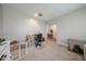 Home office or flex room with a desk, comfortable chair, and natural light, ideal for work or study at 10964 W Garfield St, Avondale, AZ 85323