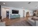 Spacious living room with stylish wood floors and a media center, offering a comfortable and inviting space at 10964 W Garfield St, Avondale, AZ 85323