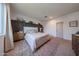 Elegant main bedroom with dark accent wall, plush carpet, and sophisticated decor at 10964 W Garfield St, Avondale, AZ 85323
