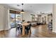 Open floorplan combines dining and living areas with backyard pool access at 1130 E Harvest Rd, San Tan Valley, AZ 85140