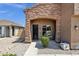 Charming front porch with brick accents and well-maintained landscaping welcomes you home at 1130 E Harvest Rd, San Tan Valley, AZ 85140