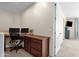 Home office boasts built-in desk and cabinets providing ample space for work and storage at 1130 E Harvest Rd, San Tan Valley, AZ 85140