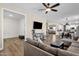Open concept living room with access to dining area, kitchen, and downstairs at 1130 E Harvest Rd, San Tan Valley, AZ 85140