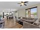 Spacious living room connects to dining area and kitchen in open floor plan at 1130 E Harvest Rd, San Tan Valley, AZ 85140
