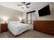 Spacious main bedroom with ceiling fan and view of the neighborhood at 1130 E Harvest Rd, San Tan Valley, AZ 85140