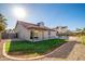 A private backyard features a red-tiled roof, covered patio, and sparkling pool, perfect for outdoor living at 11615 N 77Th Dr, Peoria, AZ 85345