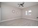 Bright bedroom with tile floors and ceiling fan at 11615 N 77Th Dr, Peoria, AZ 85345
