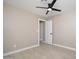 Minimal bedroom featuring tile flooring and a ceiling fan at 11615 N 77Th Dr, Peoria, AZ 85345