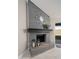 Close-up of the modern fireplace with decorative mantle and tile hearth in the living room at 11615 N 77Th Dr, Peoria, AZ 85345