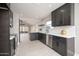 Beautiful kitchen featuring granite countertops, stainless steel appliances, and dark wood cabinetry at 11615 N 77Th Dr, Peoria, AZ 85345