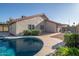 Backyard pool area featuring lovely landscaping, hardscape, and a nice side yard at 11615 N 77Th Dr, Peoria, AZ 85345