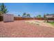 The backyard features a graveled ground cover, shed, and fenced perimeter at 1165 E Ivanhoe St, Chandler, AZ 85225