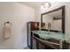 Modern bathroom featuring a unique glass vessel sink and stylish vanity with ample storage at 1165 E Ivanhoe St, Chandler, AZ 85225