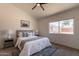 Inviting bedroom featuring a cozy bed, ample natural light, and a serene backyard view at 1165 E Ivanhoe St, Chandler, AZ 85225
