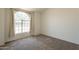Spacious bedroom featuring a large arched window, neutral tones, and ample natural light at 1165 E Ivanhoe St, Chandler, AZ 85225