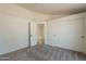 Empty Bedroom featuring a large closets and neutral carpet ready for customization at 1165 E Ivanhoe St, Chandler, AZ 85225