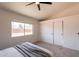 Light-filled bedroom with a large window, spacious closet, and a calming atmosphere at 1165 E Ivanhoe St, Chandler, AZ 85225
