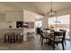 Inviting dining area with a wooden table, stylish chairs, and seamless connection to the kitchen at 1165 E Ivanhoe St, Chandler, AZ 85225