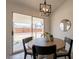 Bright dining area with sliding glass door to the yard, modern light, and seating at 1165 E Ivanhoe St, Chandler, AZ 85225