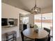 Dining area with a wooden table, modern light fixture, and access to the backyard at 1165 E Ivanhoe St, Chandler, AZ 85225