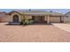 A charming single-story home featuring a tidy front yard and a two-car garage, with a tile roof at 1165 E Ivanhoe St, Chandler, AZ 85225