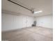 Clean, well-lit garage featuring two doors and a hot water heater at 1165 E Ivanhoe St, Chandler, AZ 85225