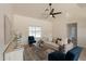 Bright living room with neutral tones, ceiling fan, and stylish decor; perfect for relaxing or entertaining at 1165 E Ivanhoe St, Chandler, AZ 85225