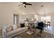 An inviting living room seamlessly connects to the kitchen, creating an open and airy space at 1165 E Ivanhoe St, Chandler, AZ 85225