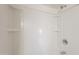 This shower features a clean, white surround, recessed shelving and sleek showerhead at 1165 E Ivanhoe St, Chandler, AZ 85225
