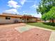 A sprawling backyard featuring a covered patio, lush grass and hardscape at 1306 W 12Th St, Tempe, AZ 85281