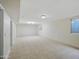Spacious basement with tile flooring and white painted brick accent walls, offering a versatile space at 1306 W 12Th St, Tempe, AZ 85281