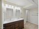 Bathroom featuring a double sink vanity with tile flooring and a neutral colored wall at 1306 W 12Th St, Tempe, AZ 85281