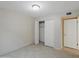Bedroom featuring tiled flooring, a standard closet, and a neutral colored wall at 1306 W 12Th St, Tempe, AZ 85281