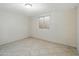 Bedroom featuring a window, updated tile flooring and freshly painted brick walls at 1306 W 12Th St, Tempe, AZ 85281