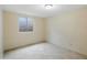 Cozy room featuring tiled flooring, an egress window, and neutral colored walls at 1306 W 12Th St, Tempe, AZ 85281