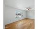 Bright, vacant bedroom featuring hardwood floors, neutral walls, and a ceiling fan at 1306 W 12Th St, Tempe, AZ 85281
