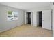 An empty bedroom with closets at 1306 W 12Th St, Tempe, AZ 85281