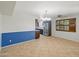 Dining area featuring tile floors, updated light fixture and view to the kitchen at 1306 W 12Th St, Tempe, AZ 85281