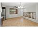 Open dining area featuring tile floors, updated light fixture and view to the stairs at 1306 W 12Th St, Tempe, AZ 85281