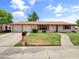 Charming ranch-style home featuring a three-car garage, well-kept lawn, and appealing curb appeal at 1306 W 12Th St, Tempe, AZ 85281