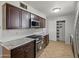 Kitchen with stainless steel appliances and granite countertops offers contemporary appeal at 1306 W 12Th St, Tempe, AZ 85281