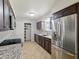 Updated kitchen with stainless steel appliances and granite countertops offers modern appeal at 1306 W 12Th St, Tempe, AZ 85281
